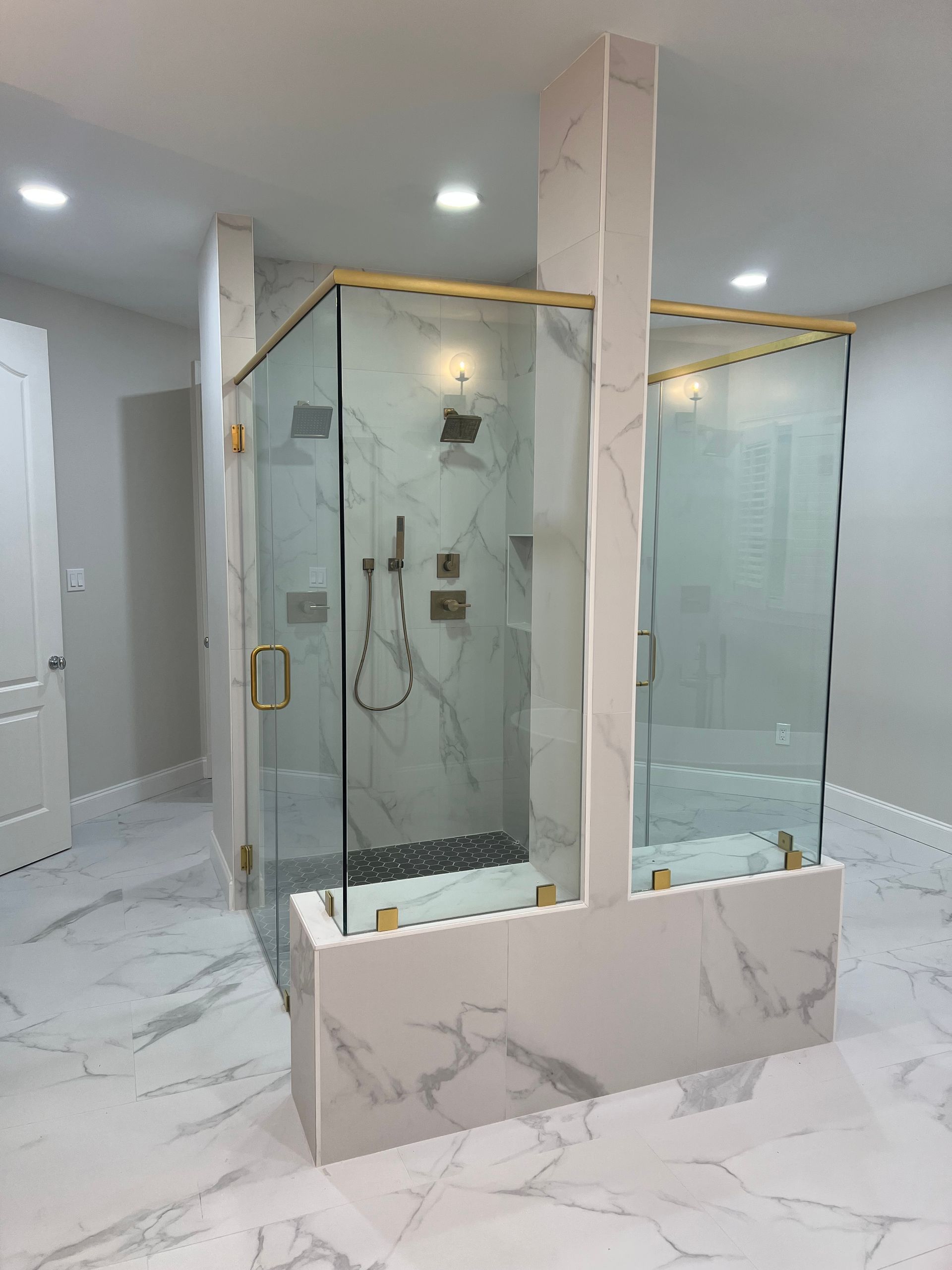 A bathroom with a walk-in shower and a bathtub.