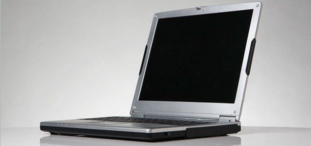 Laptop on a plain background