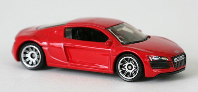Red toy car on a plain background