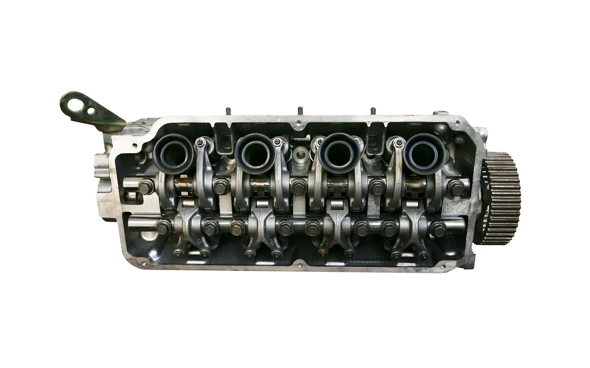 Engine cylinder head with exposed valves and camshaft.