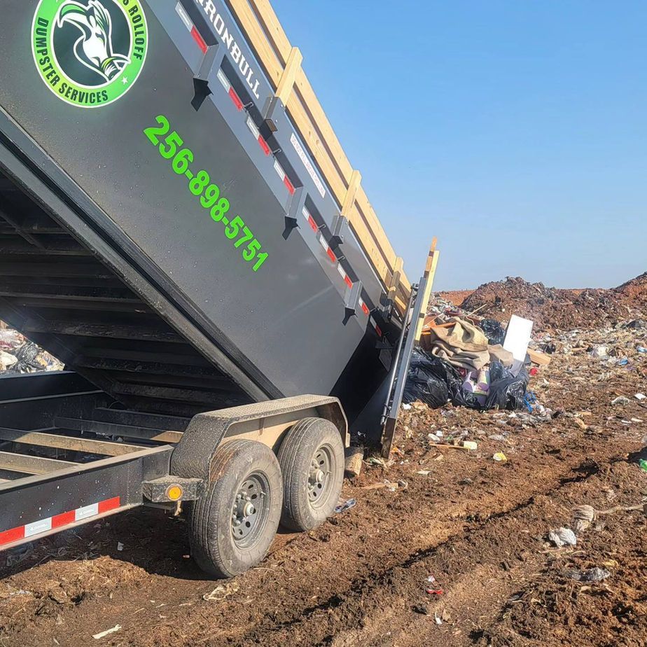 A dumpster with the number 256-988-3751 on it