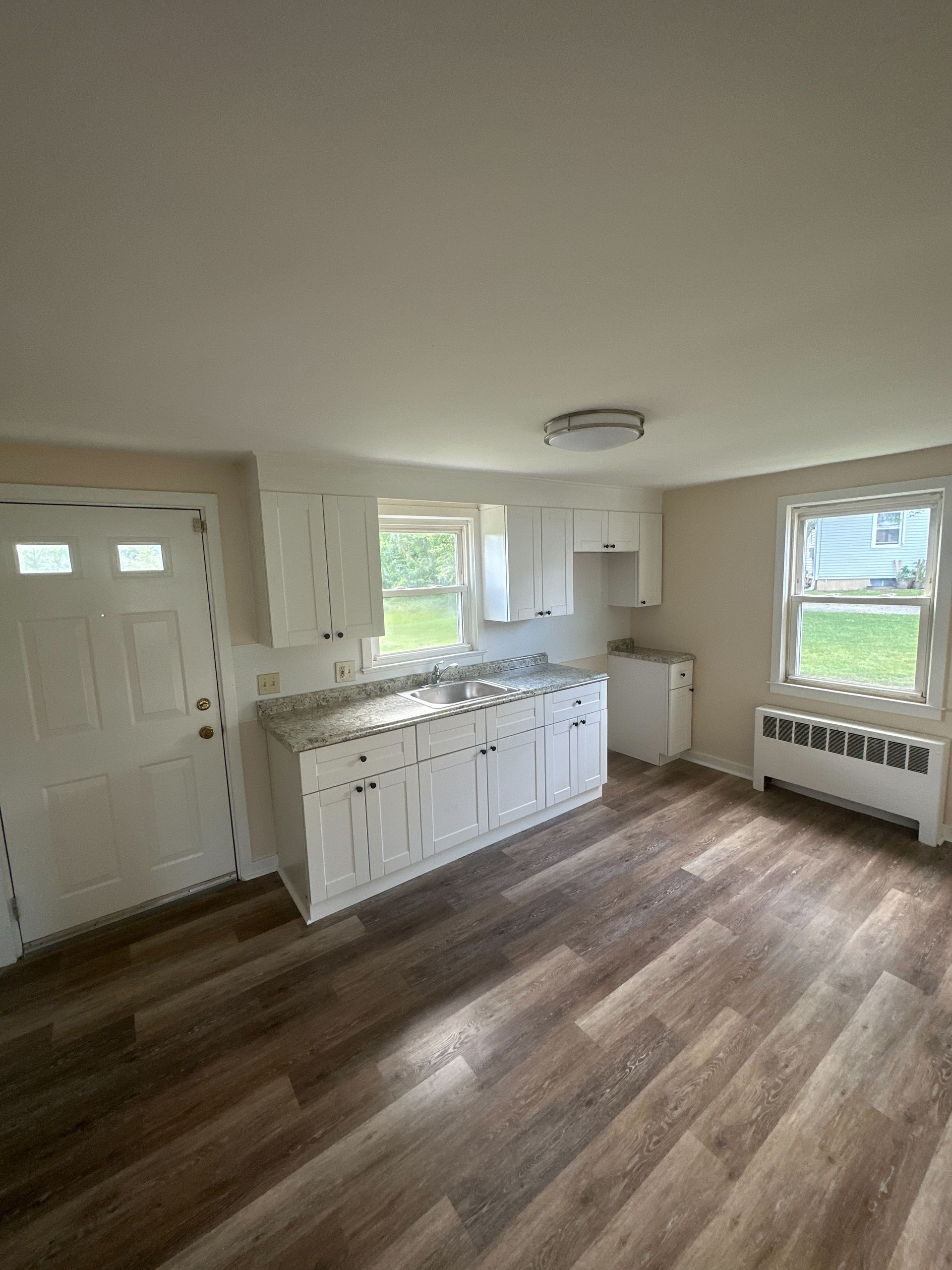 There is a kitchen in the middle of the room.