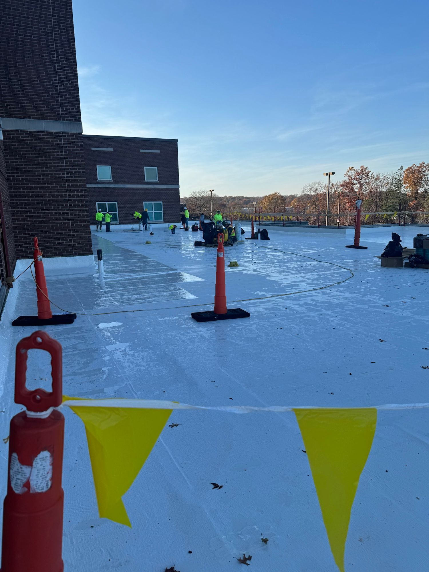 A snowmobile is parked on the roof of a building.
