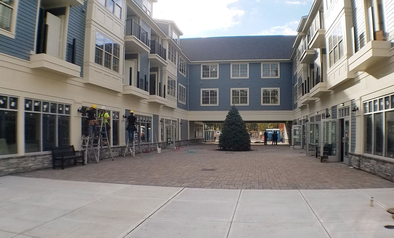 A large building with a christmas tree in the middle of it