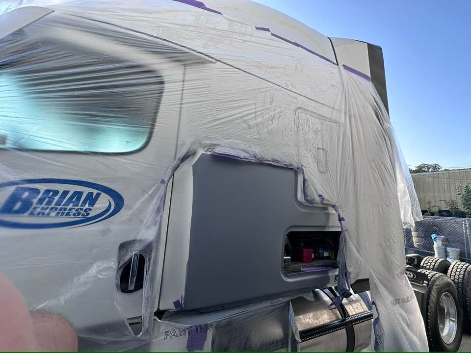 A brian express truck is covered in plastic wrap.