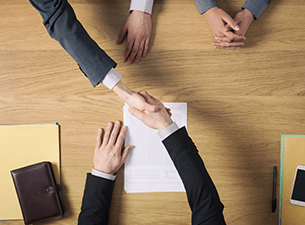 Employer and applicant shaking hands