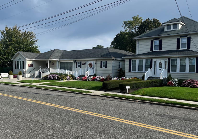 A row of houses on the side of a road