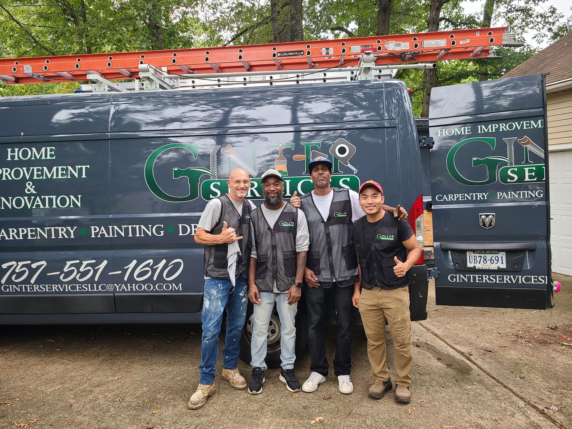 Five workers stand smiling in front of a green GSE service van with a ladder on top.