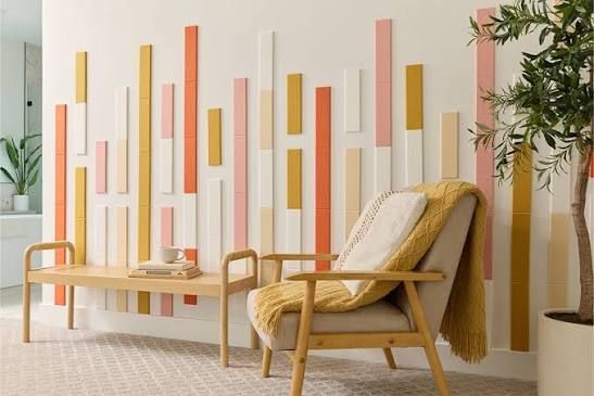 Bright living room with a wooden chair, coffee table, and colorful wall slats beside a plant