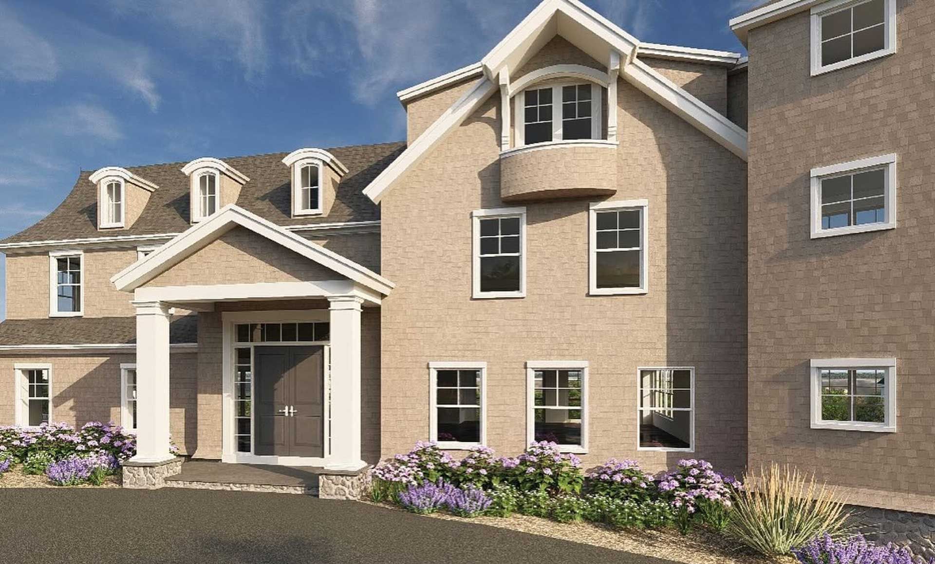 Beige brick building with arched windows, entrance under a portico, and landscaping.