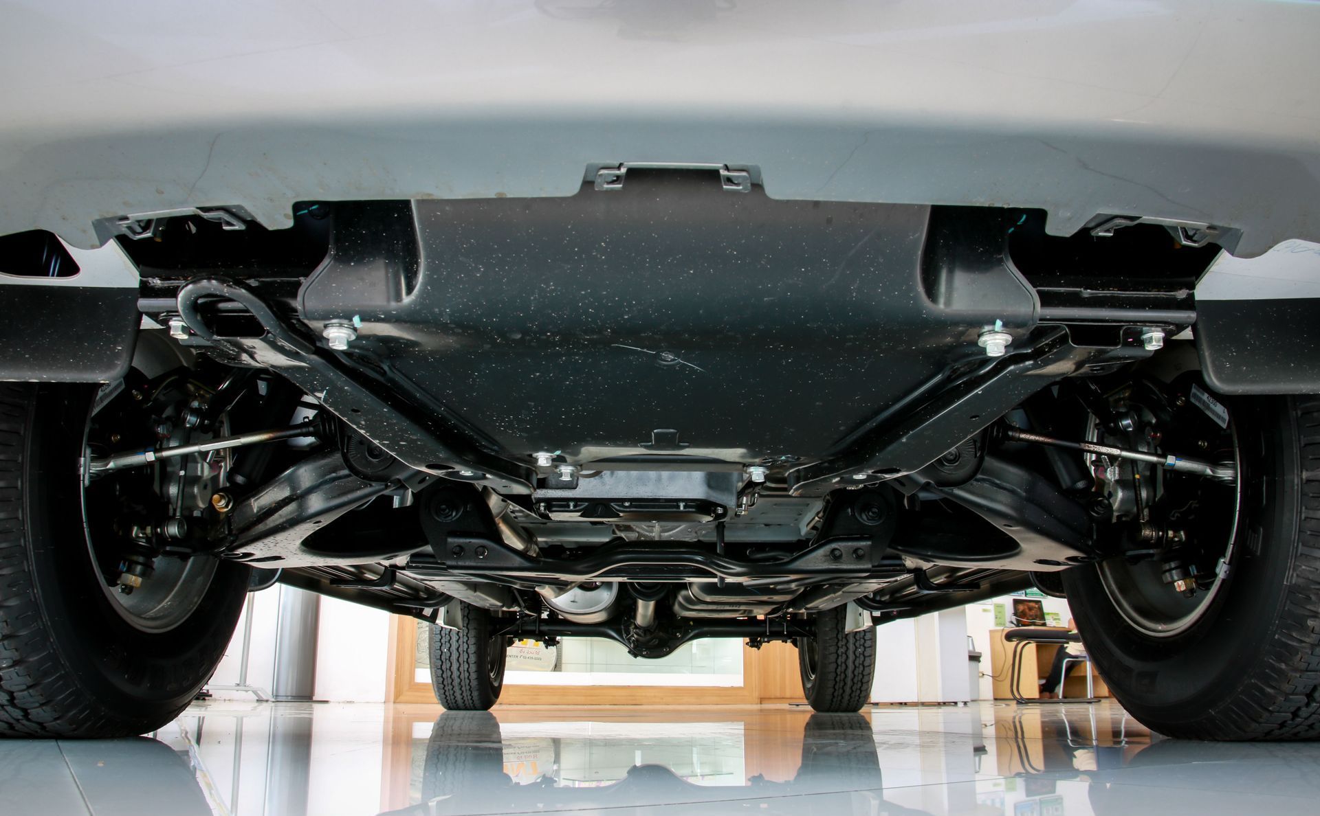 A car is being painted in a paint booth.