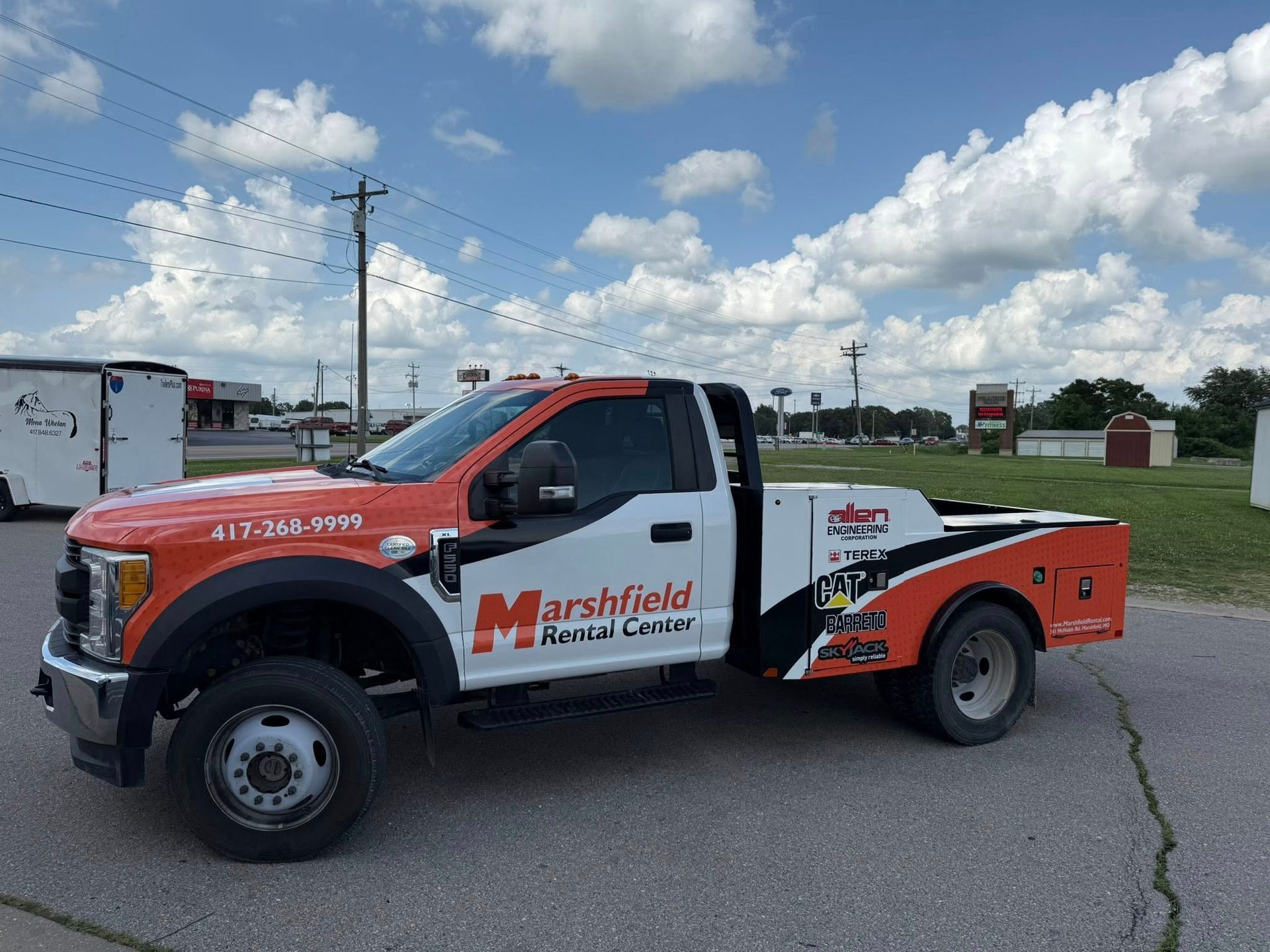 Marshfield Welding service truck parked outdoors under a cloudy sky
