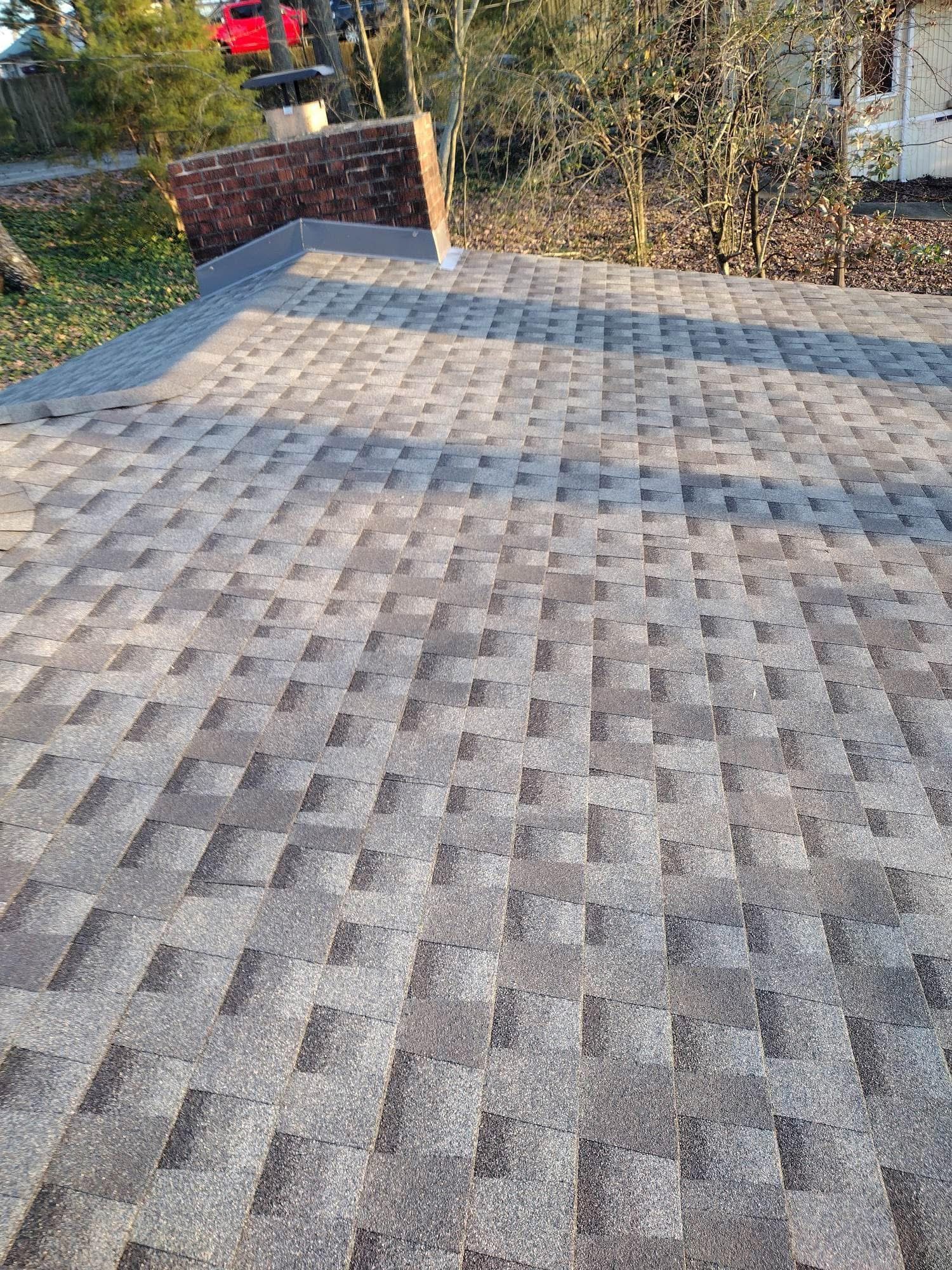 Gray and brown asphalt shingle roof.