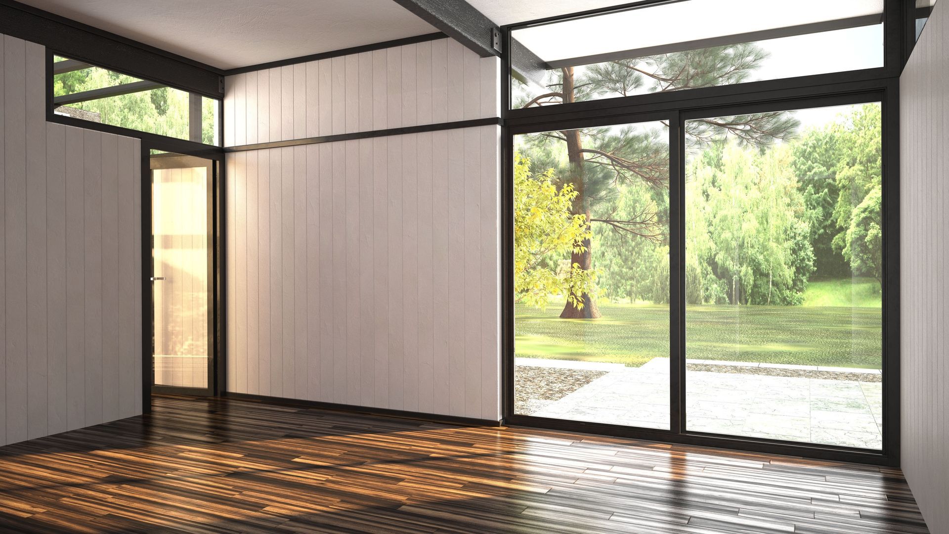 Empty modern room with dark wood floor and large windows looking onto a bright green garden