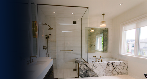 Modern bathroom with glass shower, marble vanity, and a window letting in natural light.