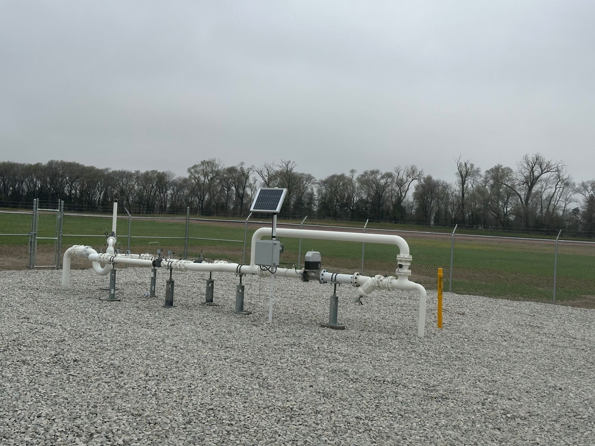 A row of pipes with a solar panel on top of them