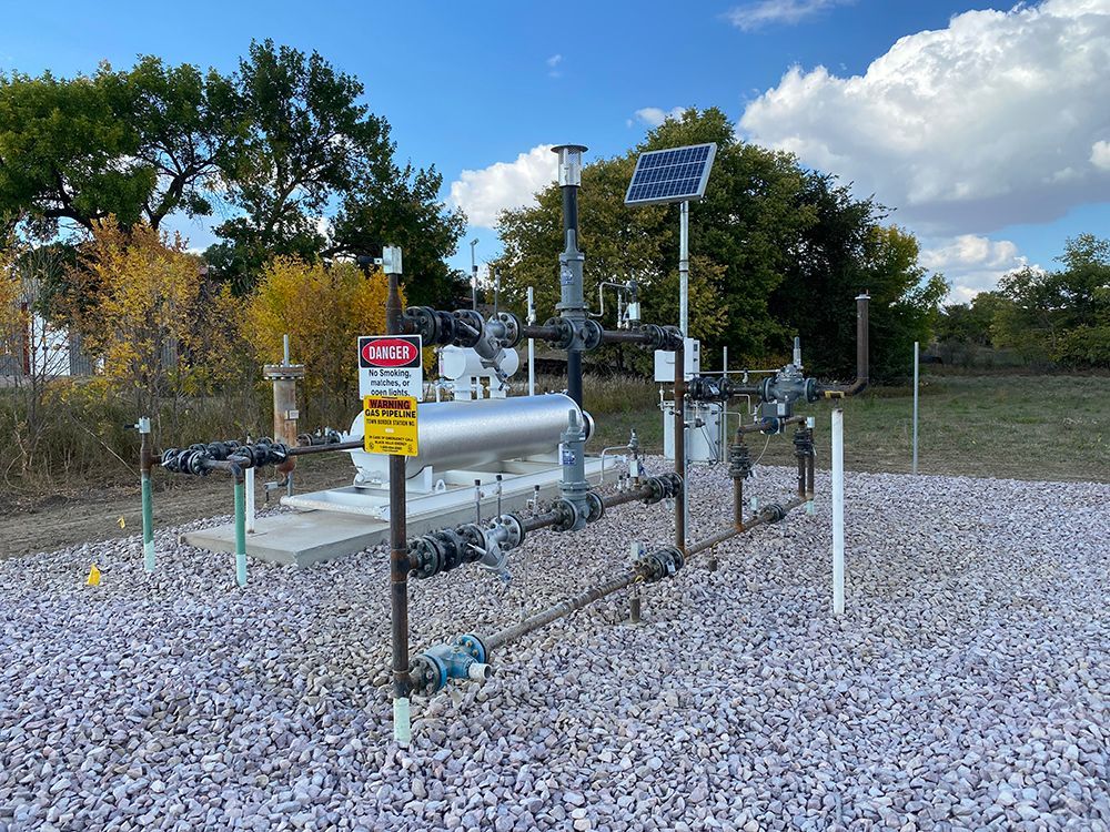 A gas pipeline on a gravel field