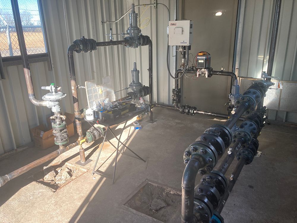 A room with a lot of pipes and valves