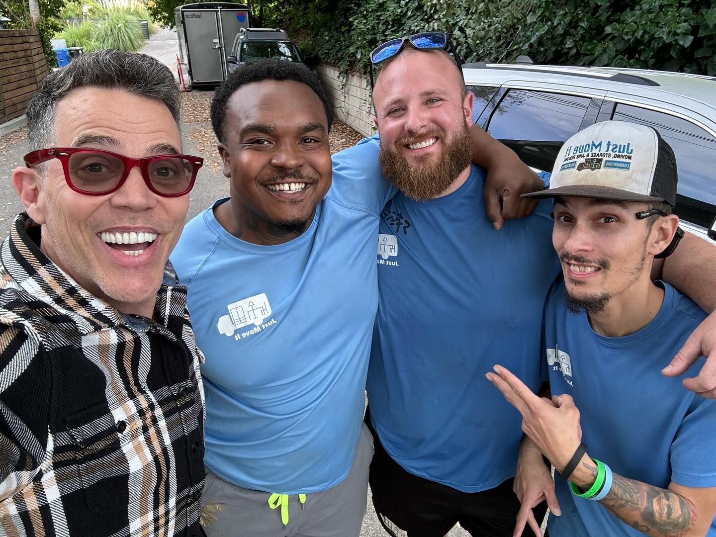 A group of men are posing for a picture together.