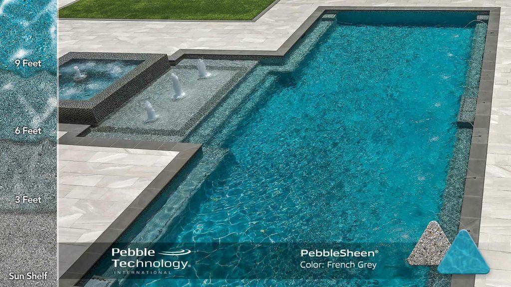 Pool with turquoise water, spa, fountains, and stone patio. PebbleSheen finish.