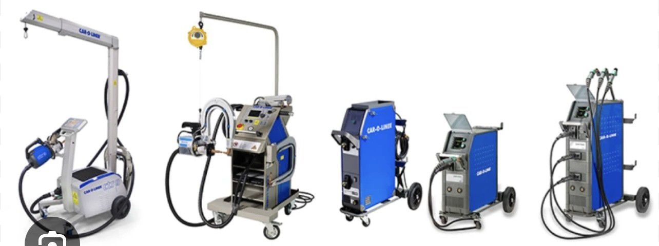 Five blue and gray welding machines on wheels, lined up against a white background. Some machines have a pivoting arm or handle.