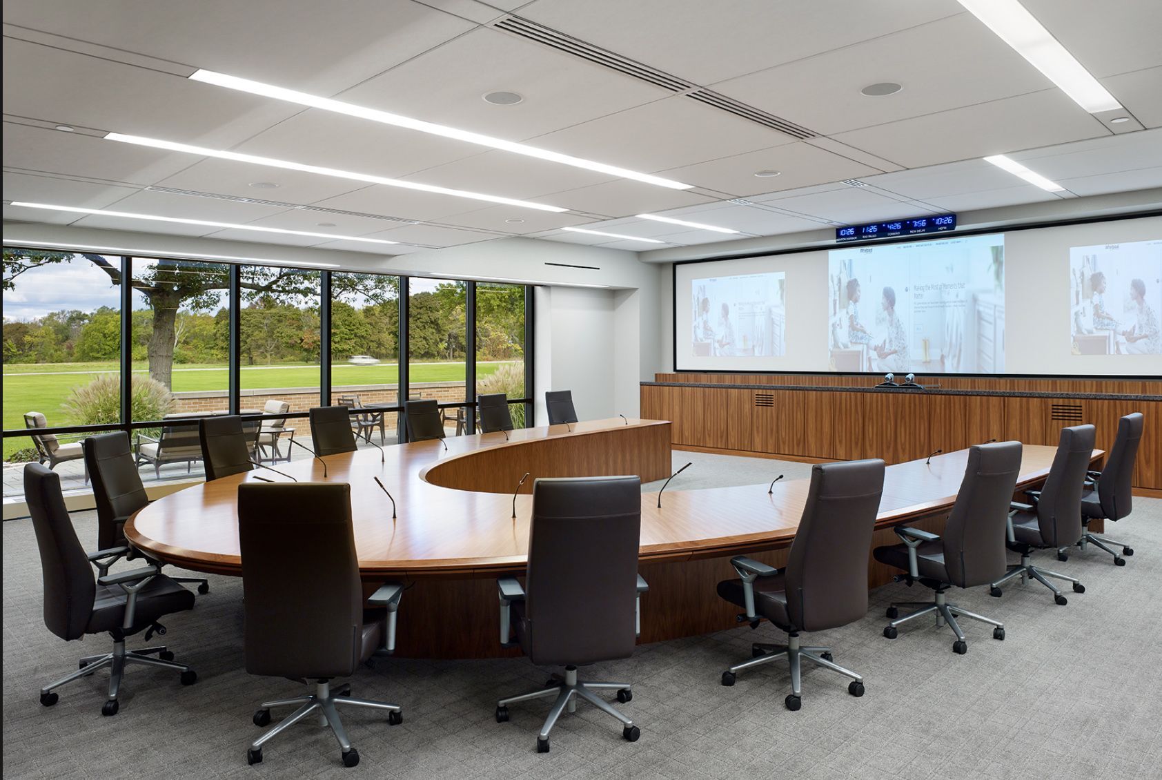 A conference room with a large table and chairs