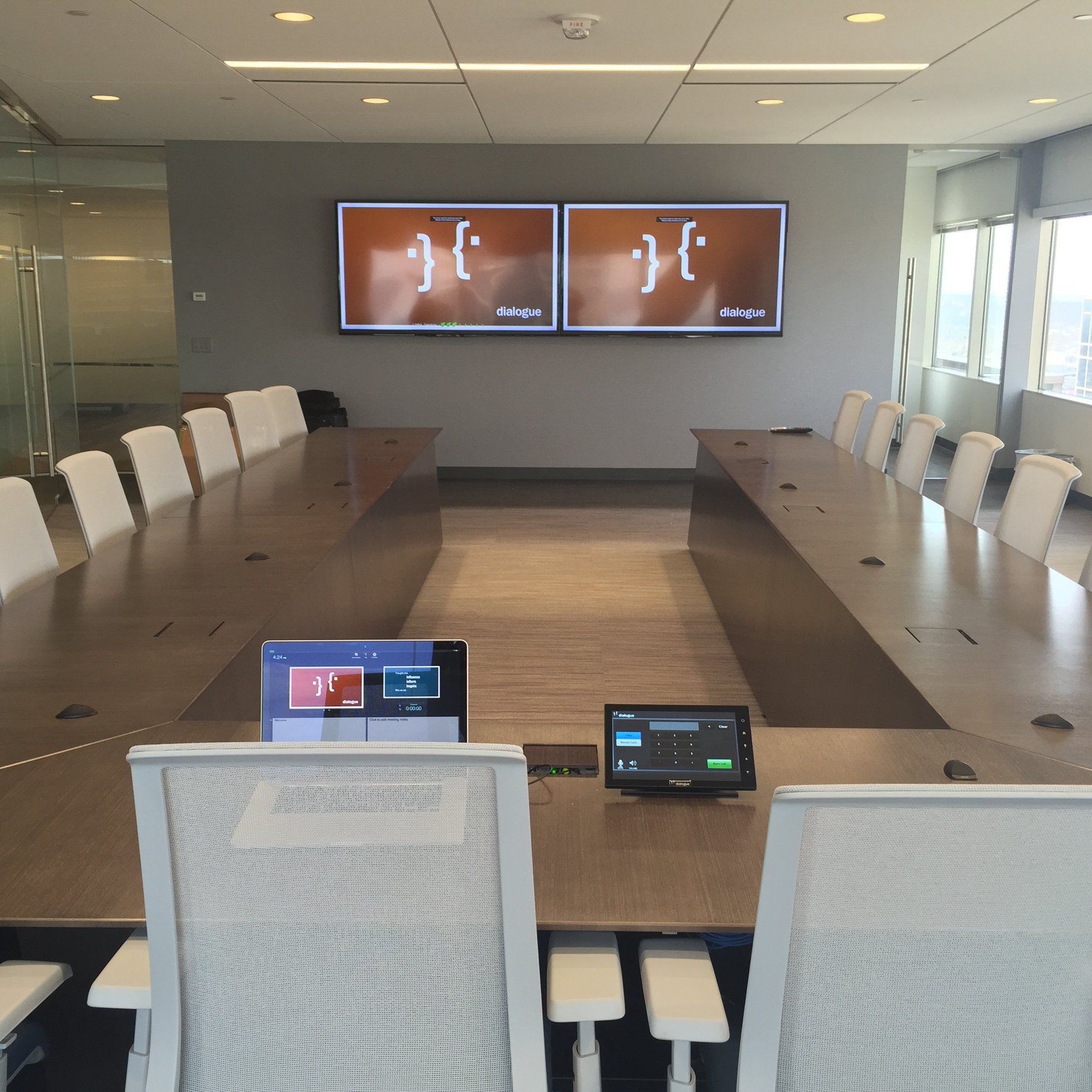 A conference room with a long table and chairs
