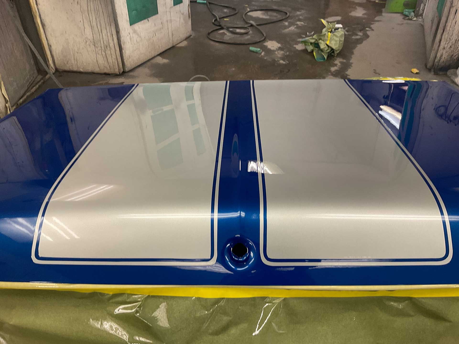 A blue and silver car trunk lid