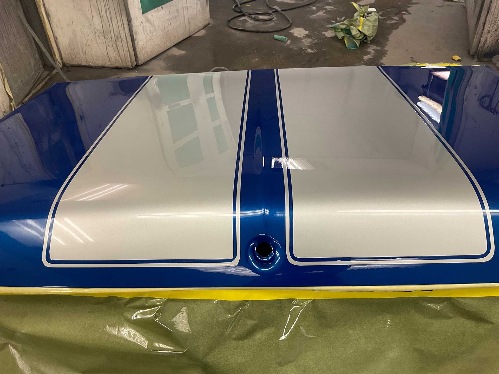 A blue and silver deck lid