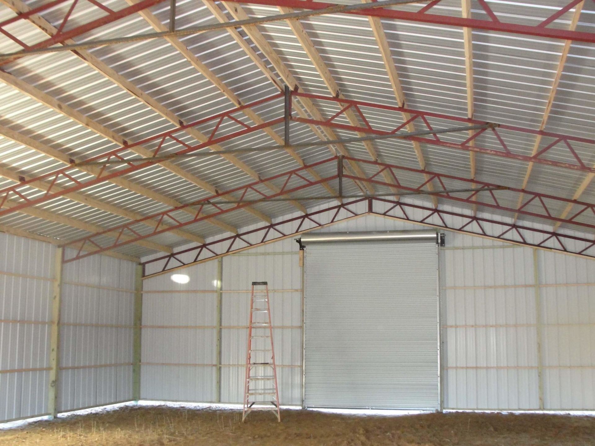 There is a ladder in the middle of the building.