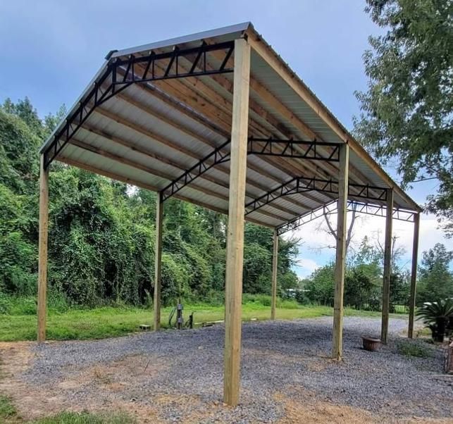 A wooden structure with a metal frame and a roof