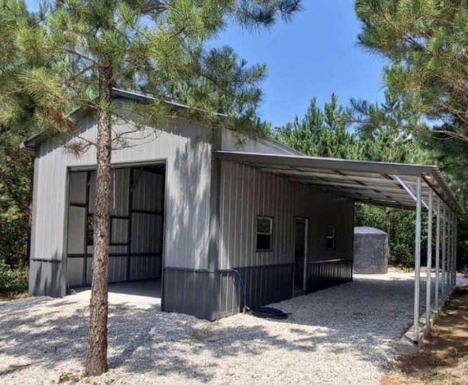 A metal building with a carport underneath it
