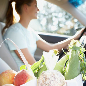 woman driving with groceries