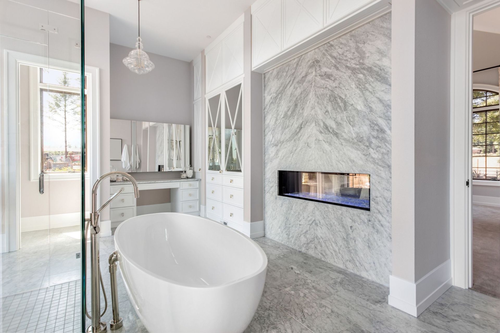 A bathroom with a bathtub and a fireplace