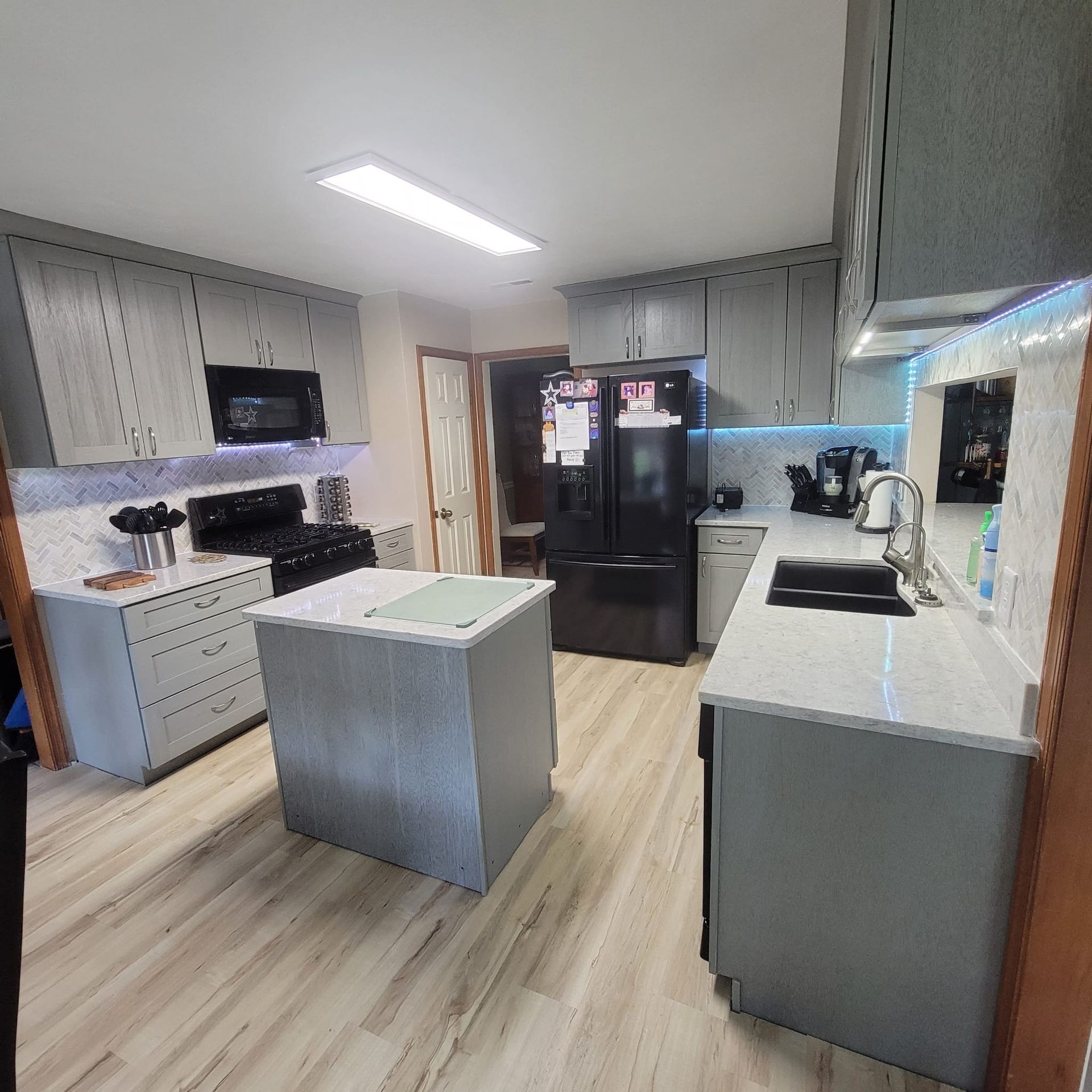 A kitchen with a large island in the middle of it