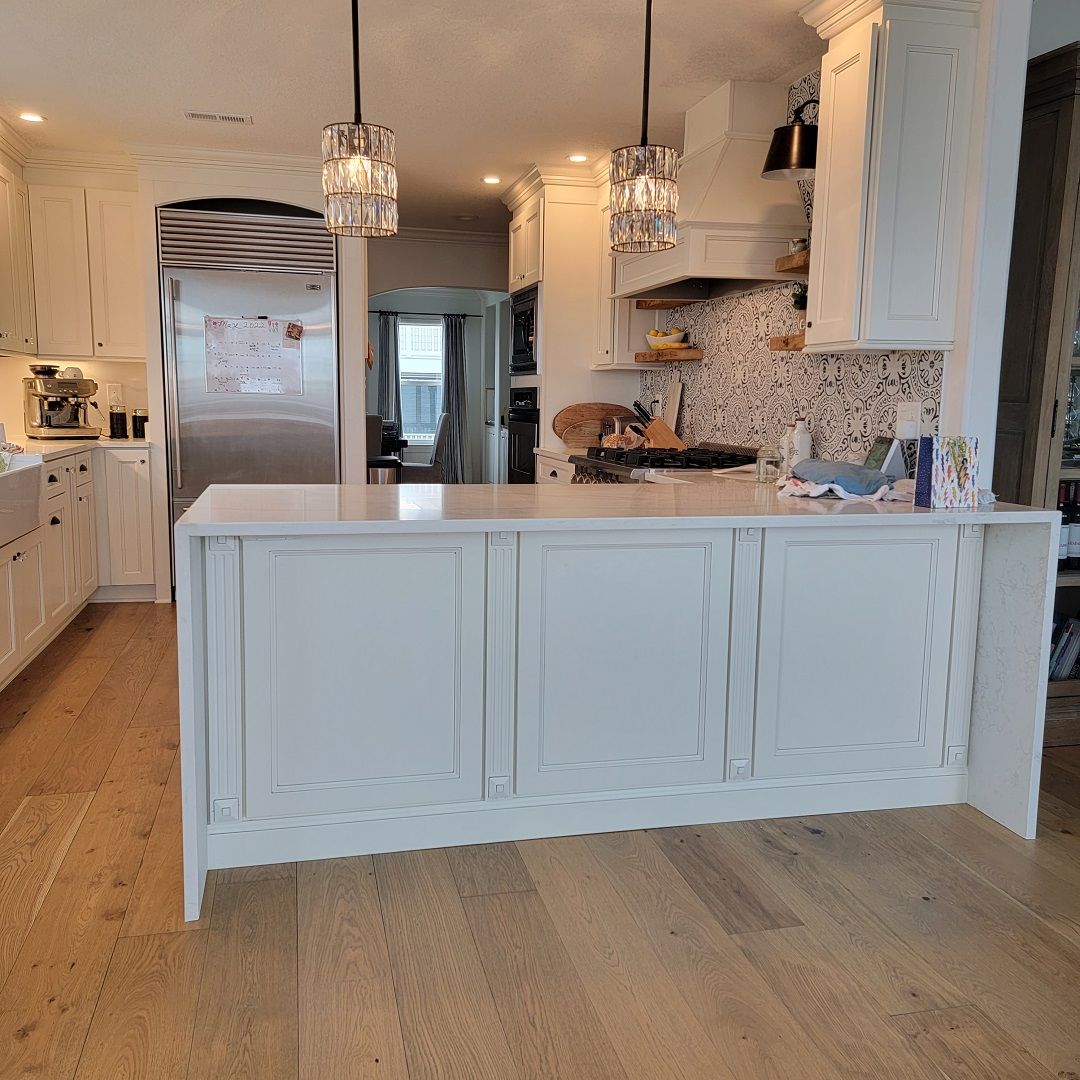 There is a large island in the middle of the kitchen