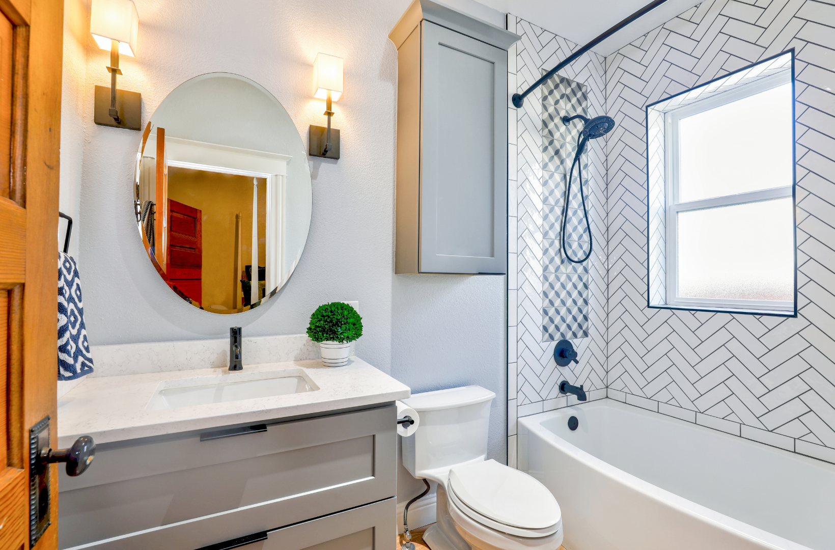 A bathroom with a toilet, sink, and bathtub