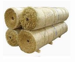 A stack of four large, cylindrical rolls of beige erosion control straw matting on a white background.