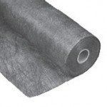 A roll of grey, non-woven landscape fabric for weed control and drainage.
