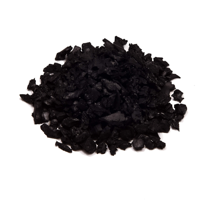 Pile of black rubber mulch on a white background