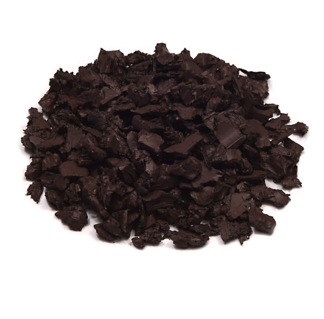 Pile of brown rubber mulch on a white background