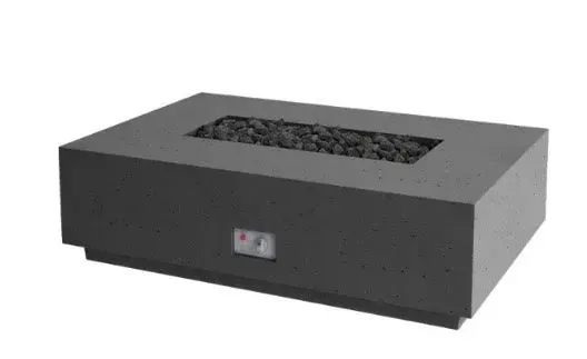 A dark gray, rectangular outdoor gas fire pit filled with black lava rocks on a white background.