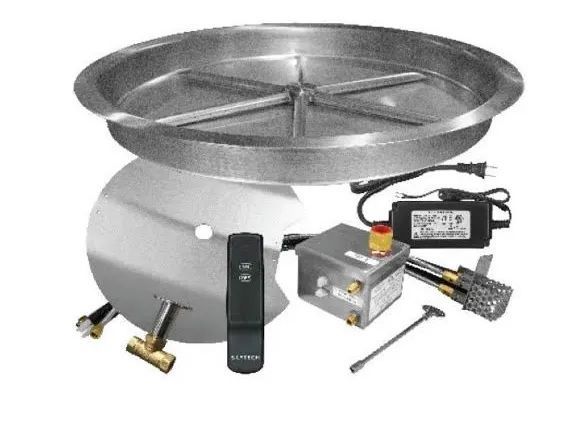 A fire pit kit including a steel pan, remote control, control box, gas valve, and electrical adapter.