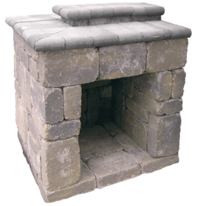 A small, square outdoor fireplace or grill made of weathered, multi-tonal gray stacked stone blocks.