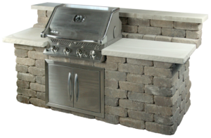 Outdoor brick grill station featuring a stainless steel grill, side counters, and a built-in storage cabinet.