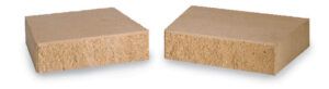 Two beige, rectangular blocks of compressed particle board placed side by side.