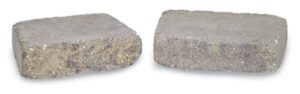 Two rectangular grey concrete paving stones resting side-by-side on a white background.