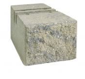 A rectangular concrete landscaping block with a rough, textured, multi-tonal gray front face.