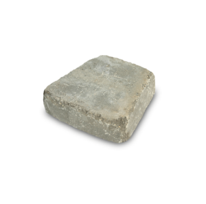 A single, rectangular gray concrete paving stone with a slightly textured, weathered surface.