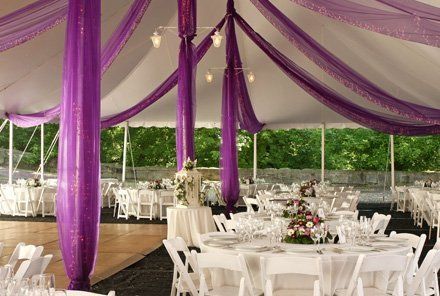 Tables and chairs in outdoor reception setting